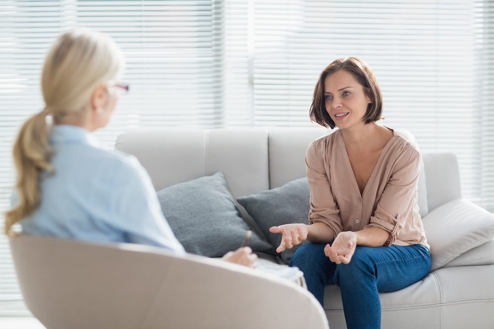 woman talking to therapist about her mental health